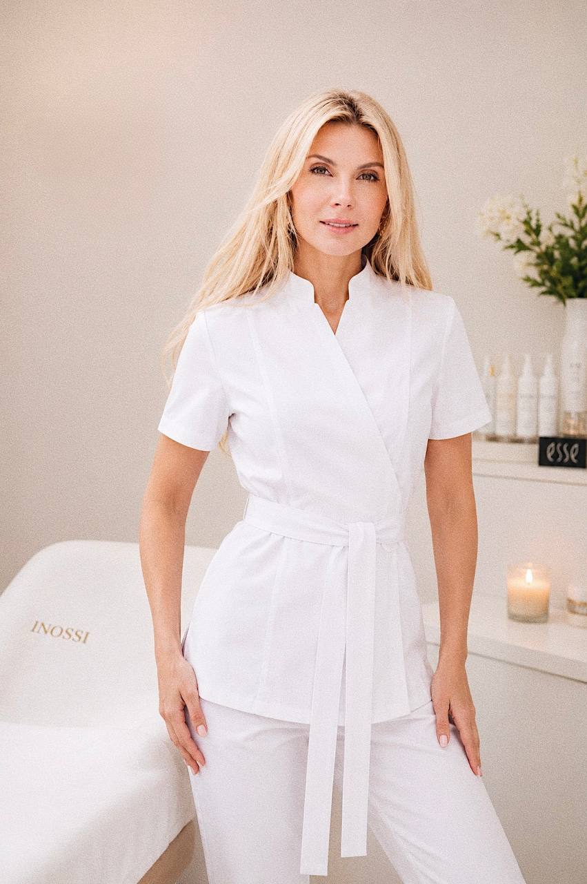 Iuliia Lyfar, certified esthetician, in the INOSSI treatment studio with professional skincare products